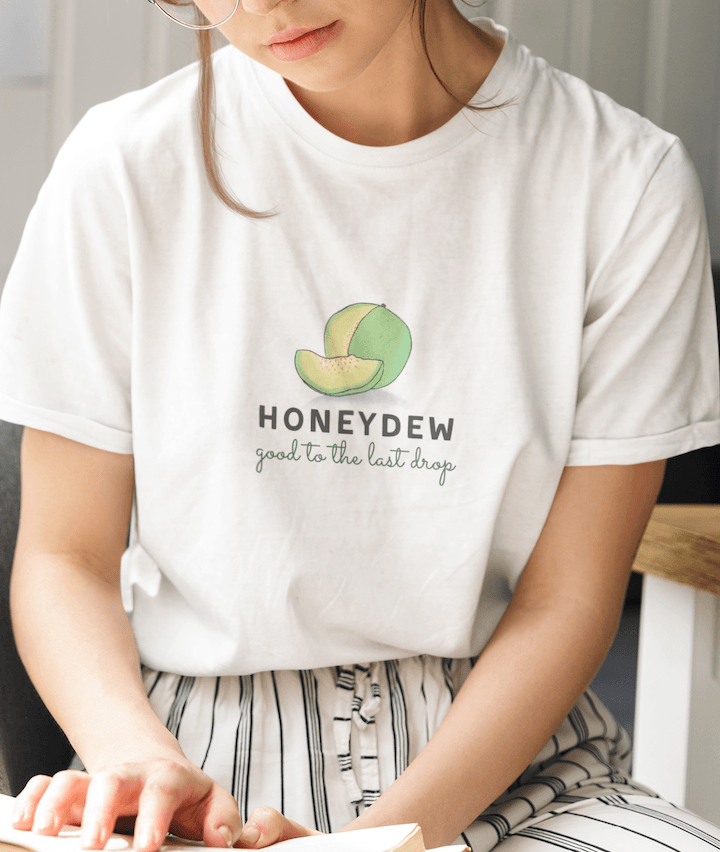 Model wearing white t-shirt with a honeydew design and the phrase "Honeydew, good to the last drop".
